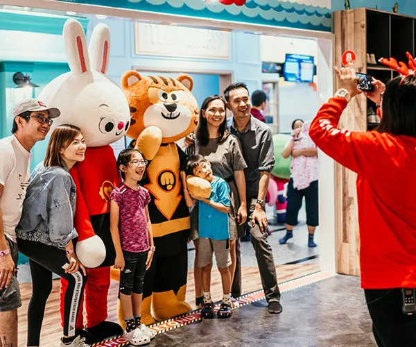 Children enjoying a slide at an indoor playground