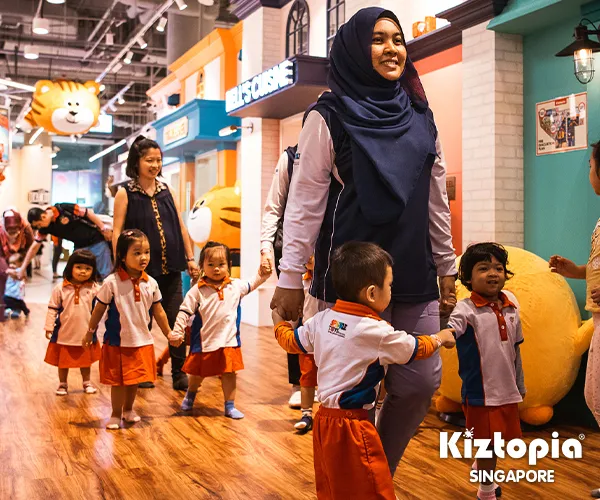 Children immersed in a large colorful ball pit, showcasing joyful playtime