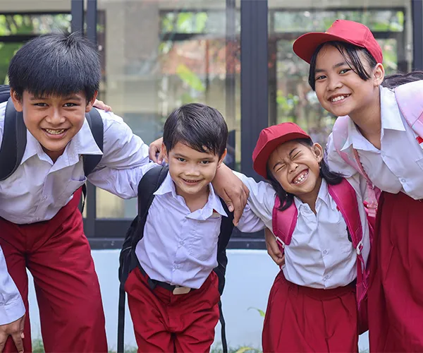Kids exploring an indoor playground structure, highlighting physical development
